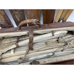 A Vintage leather cricket bag and equipment, to include cricket bats, balls, wickets, and pads. 