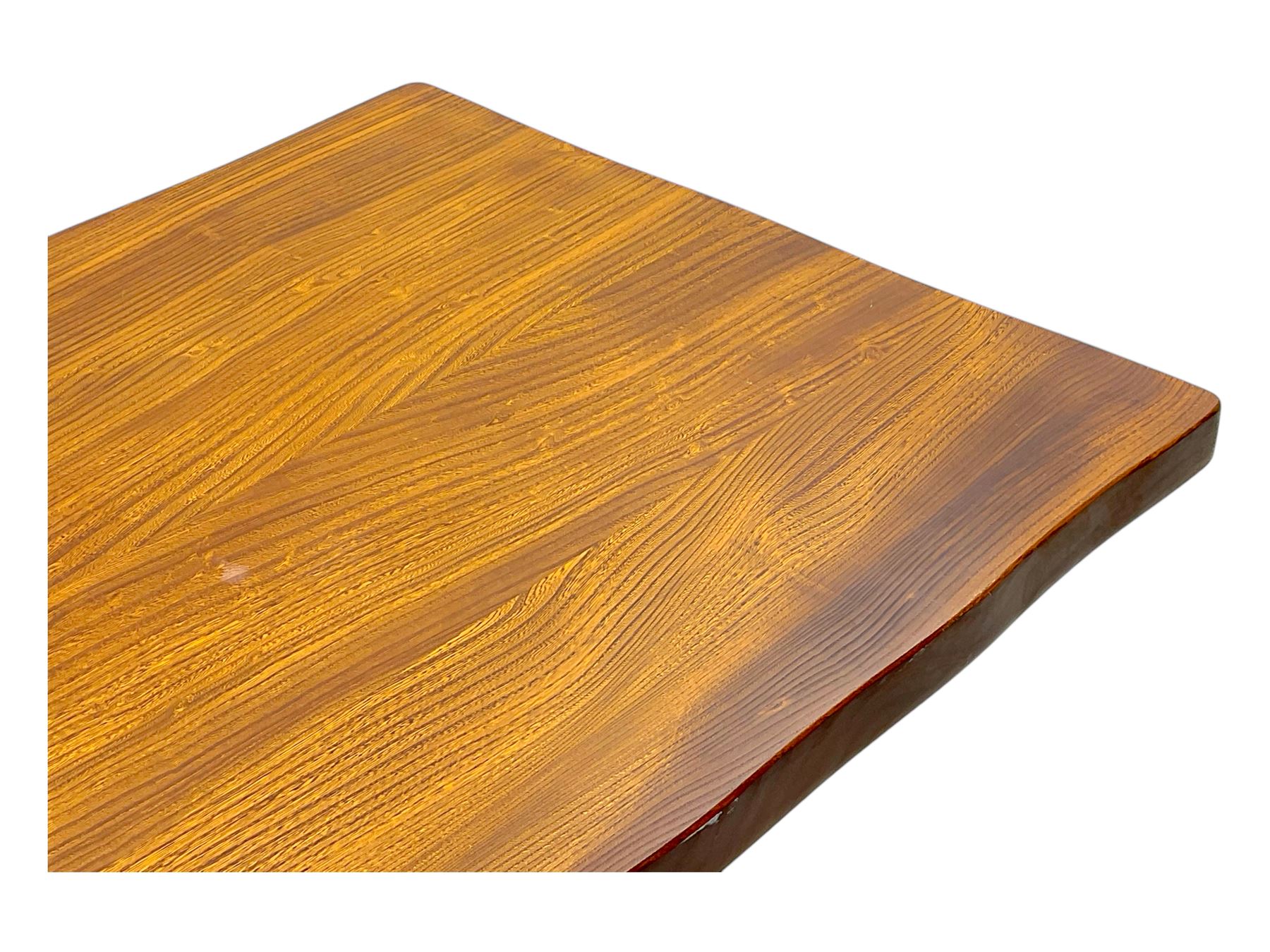 Late 20th century oak trestle table, rectangular top with naturalistic edge, supported by two curved pedestal bases united by central stretcher, on block feet