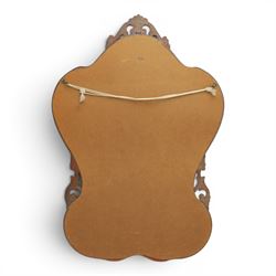 Rococo design gilt wall mirror, shaped and moulded frame, serpentine lower apron, enclosing a plain mirror 