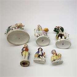 A pair of Sitzendorf porcelain figures, the first modelled as a boy playing the flute, with dog seated at his feet, the second modelled as a girl with basket of flowers and sheep stood beside her, each upon oval gilt detailed base, each with printed mark beneath, H17cm, together with a Naples figure group, a pair of small Sitzendorf figurines, and a later example marked Japan. (6). 