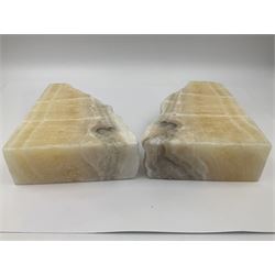 Pair of honey onyx bookends of rectangular form with polished to three sides with a raw outer edge, H18cm 