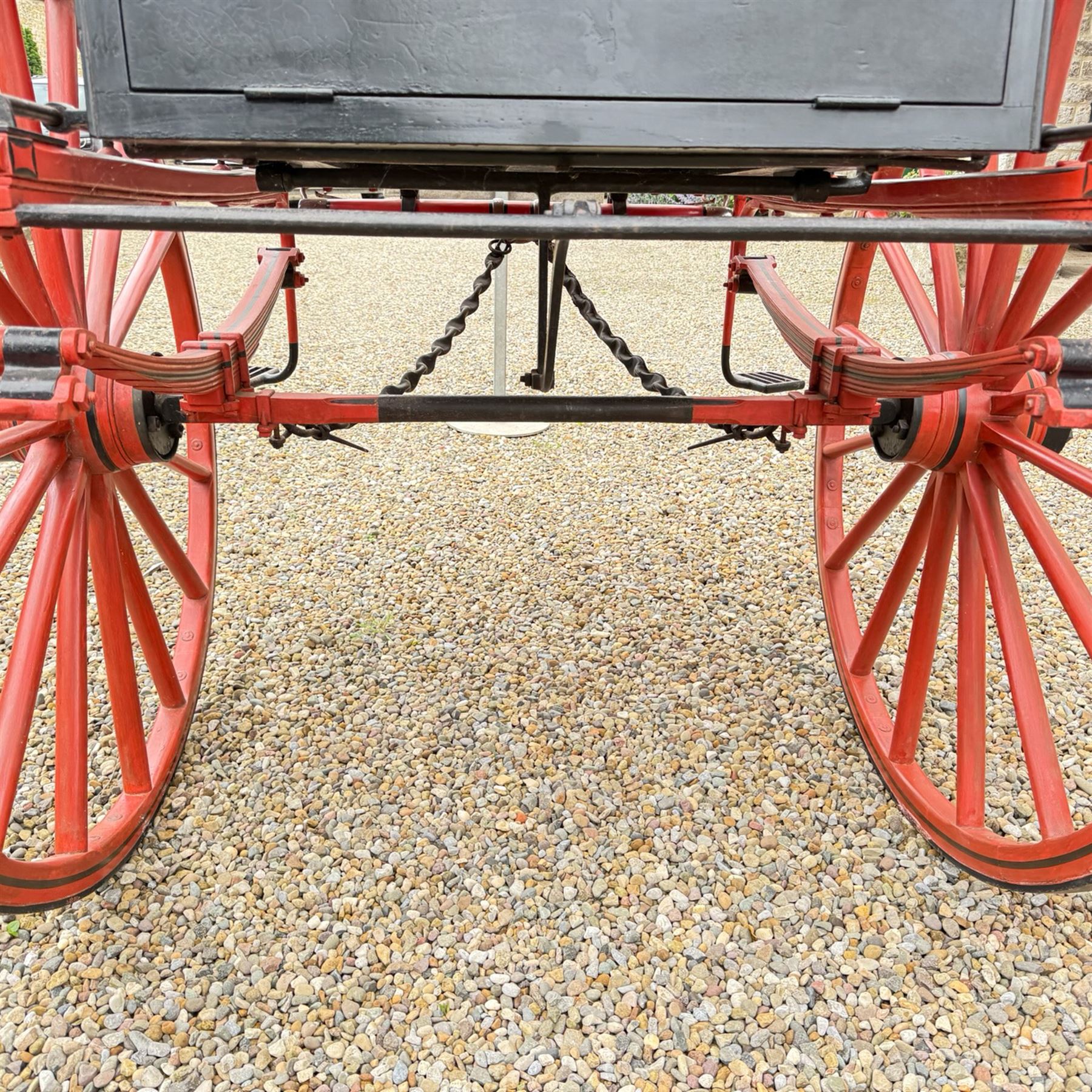 Holland & Holland Tandem Cart - Althorp Spencer Family Estate

A two wheeled tandem cart or cocking cart by Holland & Holland Coach Builders, London, with black painted bodywork, red painted shafts and running gear, red wooden spoked wheels with rubber tyres, green upholstered seating and a rear perforated metal footboard. The cart is fitted with carriage lamp brackets (lamps next lot), green buttoned cushions with leather retaining straps, side louvered body panels, footrests, leaf spring suspension and shafts for horse use. The carriage incorporates an adjustable body position, operated by a lever, allowing the body to be moved forwards or backwards to alter the weight distribution. Formerly owned by the family of Lady Diana Spencer,
Sympathetically conserved by Woods of Fairbourne Carriages Ltd, Kent.

Features:
• Brass maker’s plaque for Holland & Holland Coach Builders, London
• Two wheeled tandem cart
• Black painted body with red painted shafts and running gear
• Red wooden spoked wheels with rubber tyres
• Green upholstered cushions with leather retaining straps
• Adjustable carriage body for weight distribution
• Lever operated adjustment mechanism
• Perforated rear footboard
• Side footrests
• Louvered side panels
• Leaf spring suspension
• Rear opening storage compartment
• Decorative painted armorial motif to rear panel
• Fitted carriage lamps shown, not included in the lot (available as next lot)
• Conserved by Fairbourne Carriages Ltd
• Provenance: The Althorp Attic Sale including The Spencer Carriages, lot 195, 7 July 2010

Dimensions:
Overall length 396 / 198cm
Width 155cm
Height 190cm

Wheel Diameters:
Wheels: 148cm

Seating:
Driving seats: 2
Passenger seats: 2