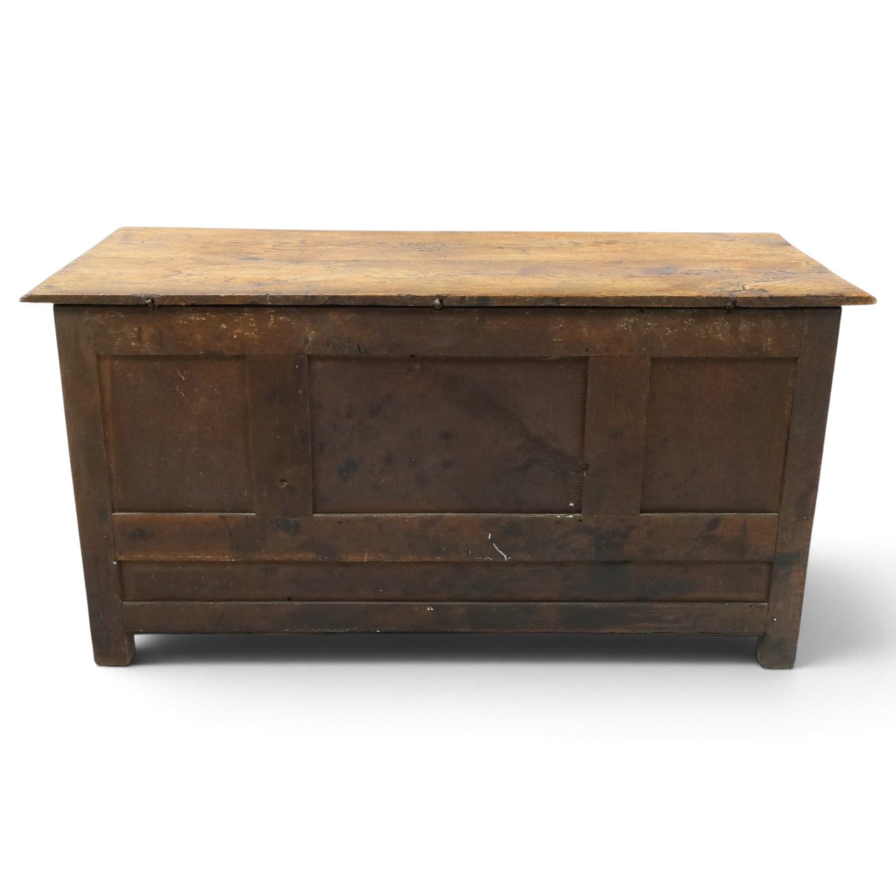 18th century carved oak coffer, rectangular hinged top over a lunette-carved frieze and tracery-style carved triple panelled front, the lower rail carved with repeating anthemion motifs, on square feet