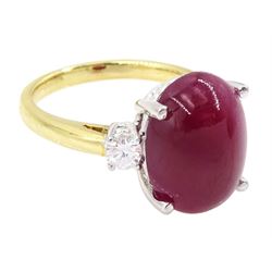 18ct gold ruby and diamond three stone ring, oval cabochon cut ruby of approx 11.40 carat, with a single round brilliant cut diamond set either side, hallmarked