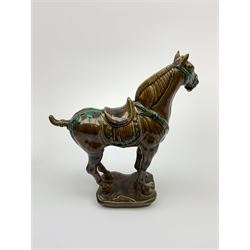 A large Beswick figure modelled as a Tang horse, with impressed marks beneath, H34cm.