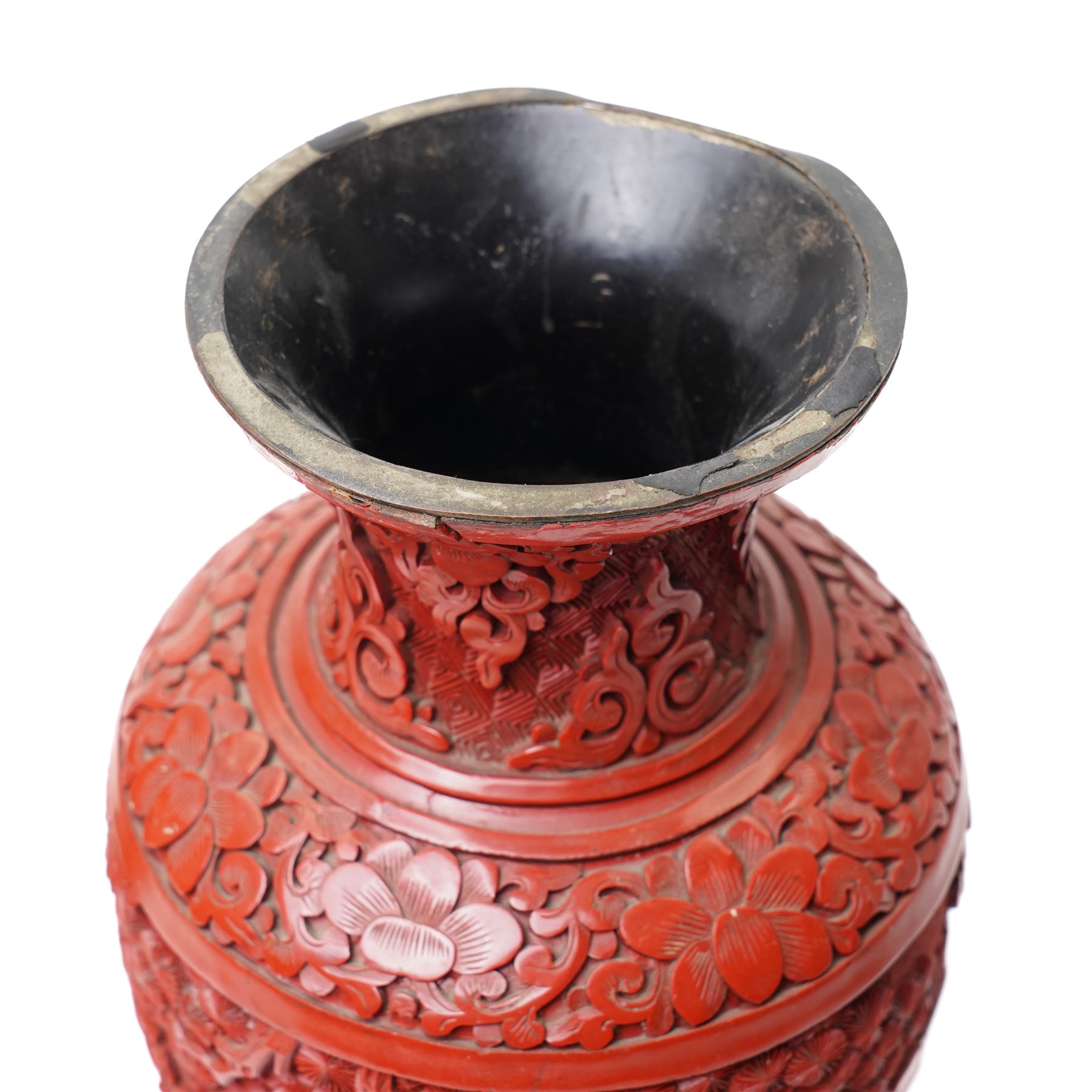 Pair of Chinese late Qing dynasty cinnabar lacquer vases, carved with scenes of figures in a landscape, H25cm (2)