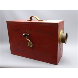  Norwegian Pattern rotary fog horn, red painted plywood body with paper label to the top, side crank handle operating the interior bellows and with a copper and brass horn and leather carry handle, L56cm, H38cm, D20cm  
