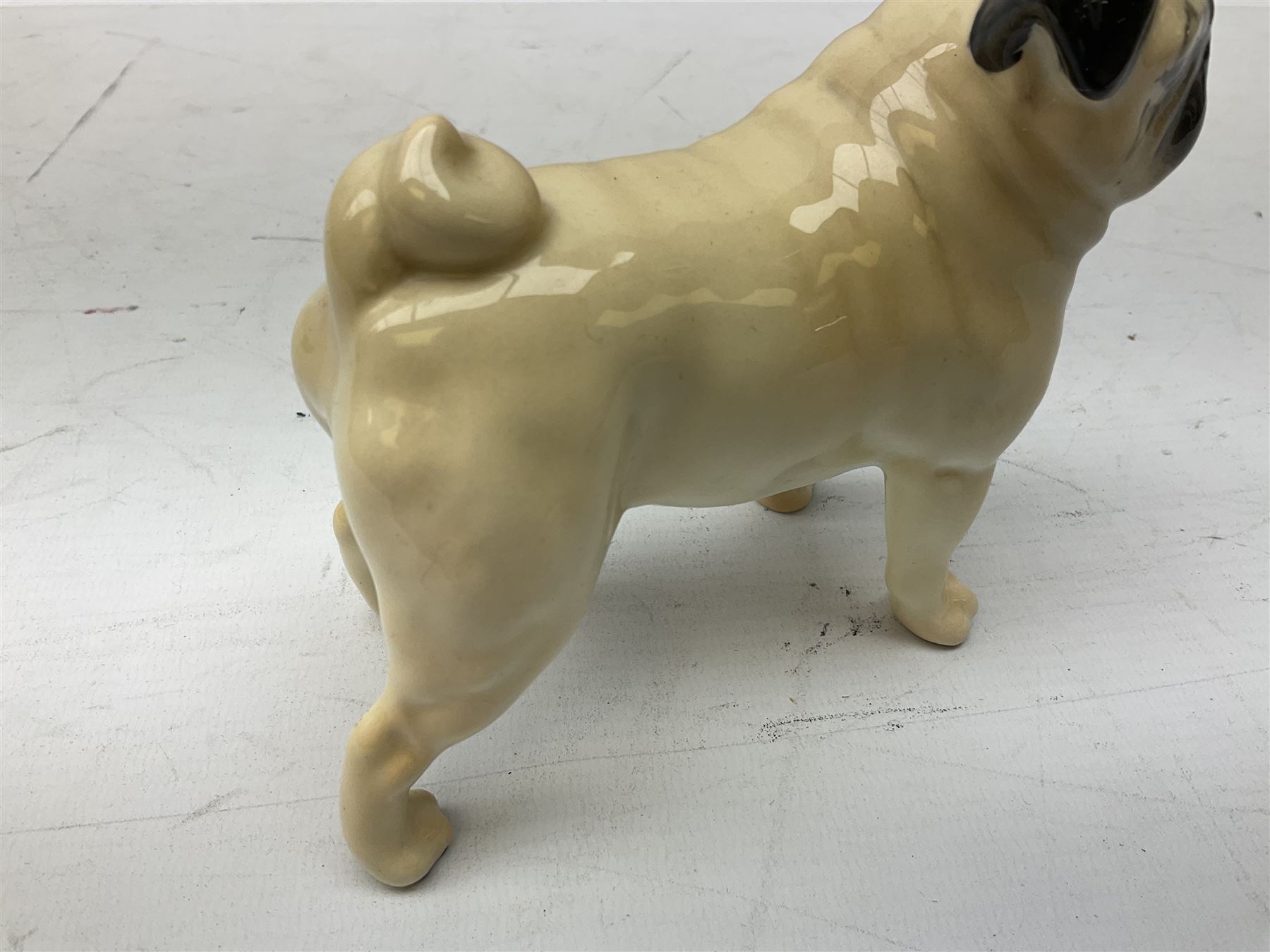 Three Beswick models comprising Hereford Bull no 949, 'CH Cutmil Cupie' Pug, and bay Shire horse, all with printed marks beneath
