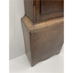 Early 19th century oak longcase clock, shaped pediment over a stepped arch glazed door enclosed by plain pilasters, the case with canted corners and trunk door with sloped arch top and centre curved return, enamel Arabic dial painted with flowers and patterned spandrels, signed 'Jno. Hilbert, Haxby', eight-day movement with subsidiary seconds dial and false calendar dial 