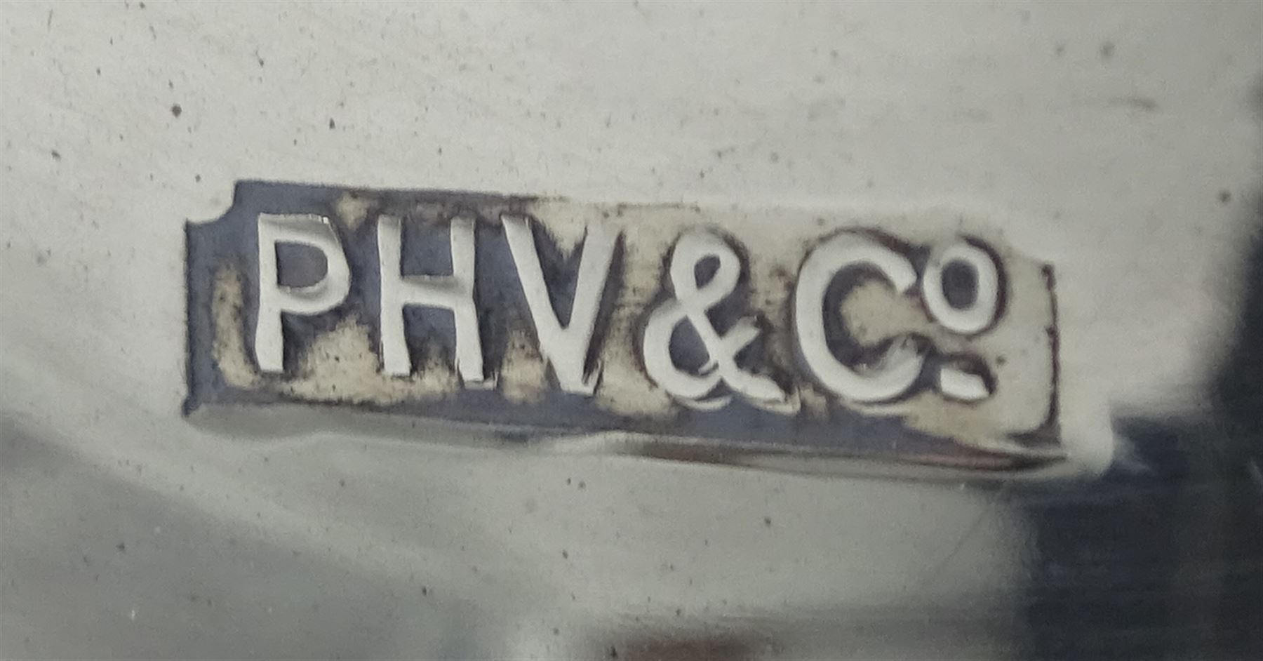 Pair of silver candlesticks by P H Vogel & Co, Birmingham 1970, silver spectacle case by W J Myatt & Co, Birmingham 1920 and five silver butter knives by James Dixon & Sons Ltd, Sheffield 1919