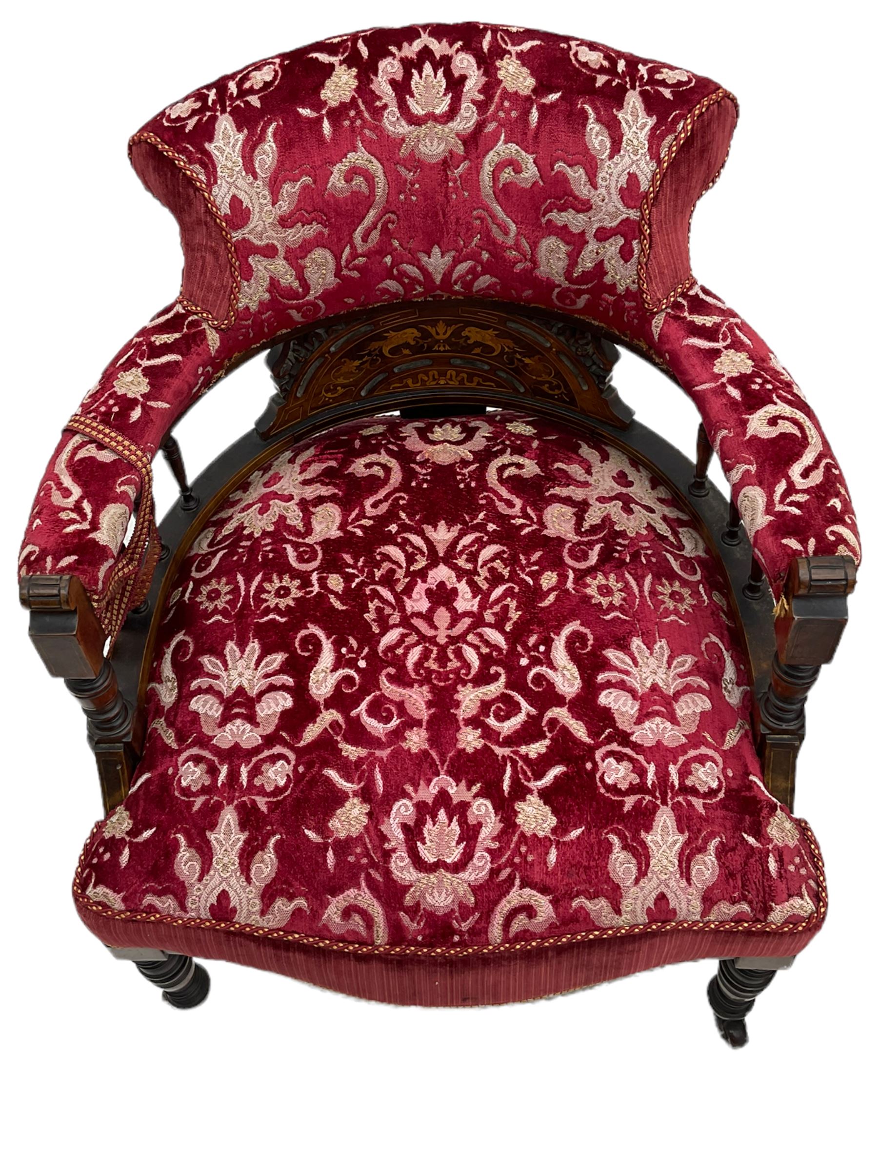 Edwardian inlaid rosewood salon suite, upholstered in red and gold fabric, comprising two seat sofa, pair of tub shaped armchairs, and four side chairs