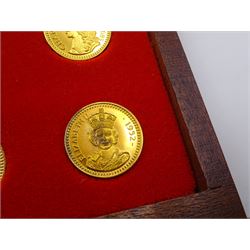 Danbury Mint, Our Royal Sovereigns Collection, seventy 22 carat gold plated silver medallions depicting the complete line of British monarchs to mark the 1200th anniversary of the first coronation, contained within wooden table top collectors cabinet with two drawers, with certificate of authenticity, with two drawers, hallmarked Danbury Mint, London various dates
