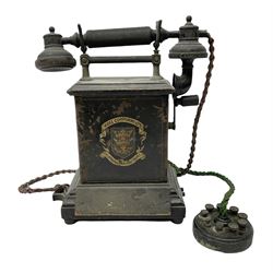 Early 20th century Danish desk telephone inscribed The Ericsson Bell Telephone Co. Glasgow to one side and Aktieselskabet Electrisk Bureau Kristiansand to the other, ebonised wooden top with handset on brass cradle. black japanned tin centre section bearing Hull Corporation Telephones Department crest, side cranking handle and ebonised wooden base H30cm  