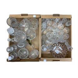 Collection of cut and moulded glassware, to include drinking glasses of various size and form, vases, bowls, decanters, etc., in two boxes 