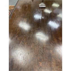 Large 19th century carved oak library table, the rectangular top with lunette carved edge over cartouche panelled and carved  scroll frieze, the central tapering rectangular support relief carved with masks and garlands, on four carved seated lion supports at each corner, on flat angular stretcher with recessed castors stamped ‘Bartholomew & Fletcher, London’