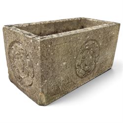 Two weathered composite stone garden trough planters, comprising a low serpentine trough relief moulded with rocaille, shell and foliate ornament (W55cm D32cm H19cm); the plain rectangular trough decorated with four moulded Yorkshire rose medallions to each side (W51cm D26cm H25cm)