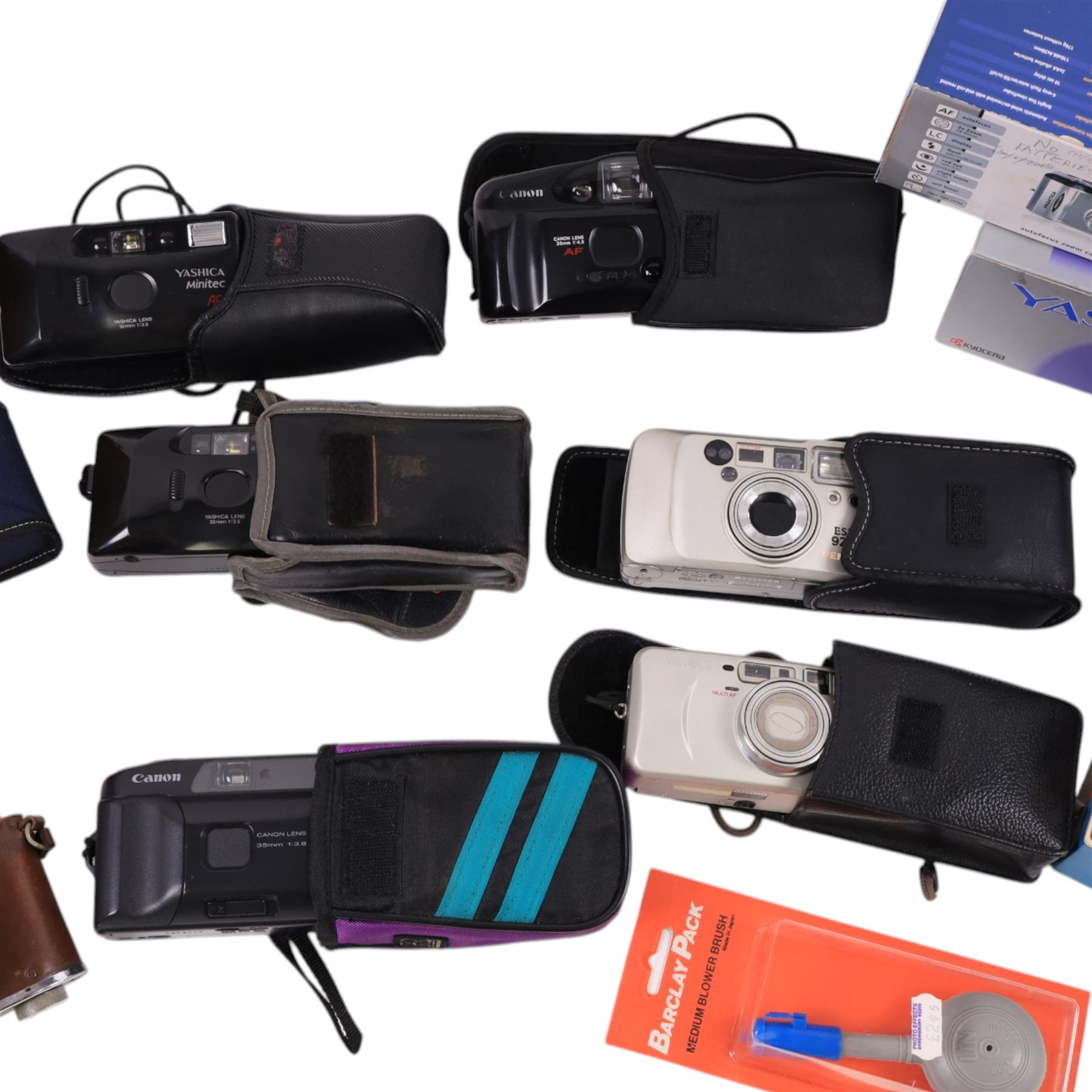 Collection of compact cameras, including Yashica, Minolta and Praktica examples, Boots binoculars, two Pentacon lenses and other accessories