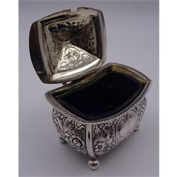 George III silver mustard pot and cover, of slight bombe form, with flat-topped handle, upon four ball feet, the body and hinged cover with later foliate embossed decoration, containing blue glass liner, hallmarked Alice & George Burrows II, London 1807, H7cm W8.5cm, approximate silver weight 4.82 ozt (150.2 grams)