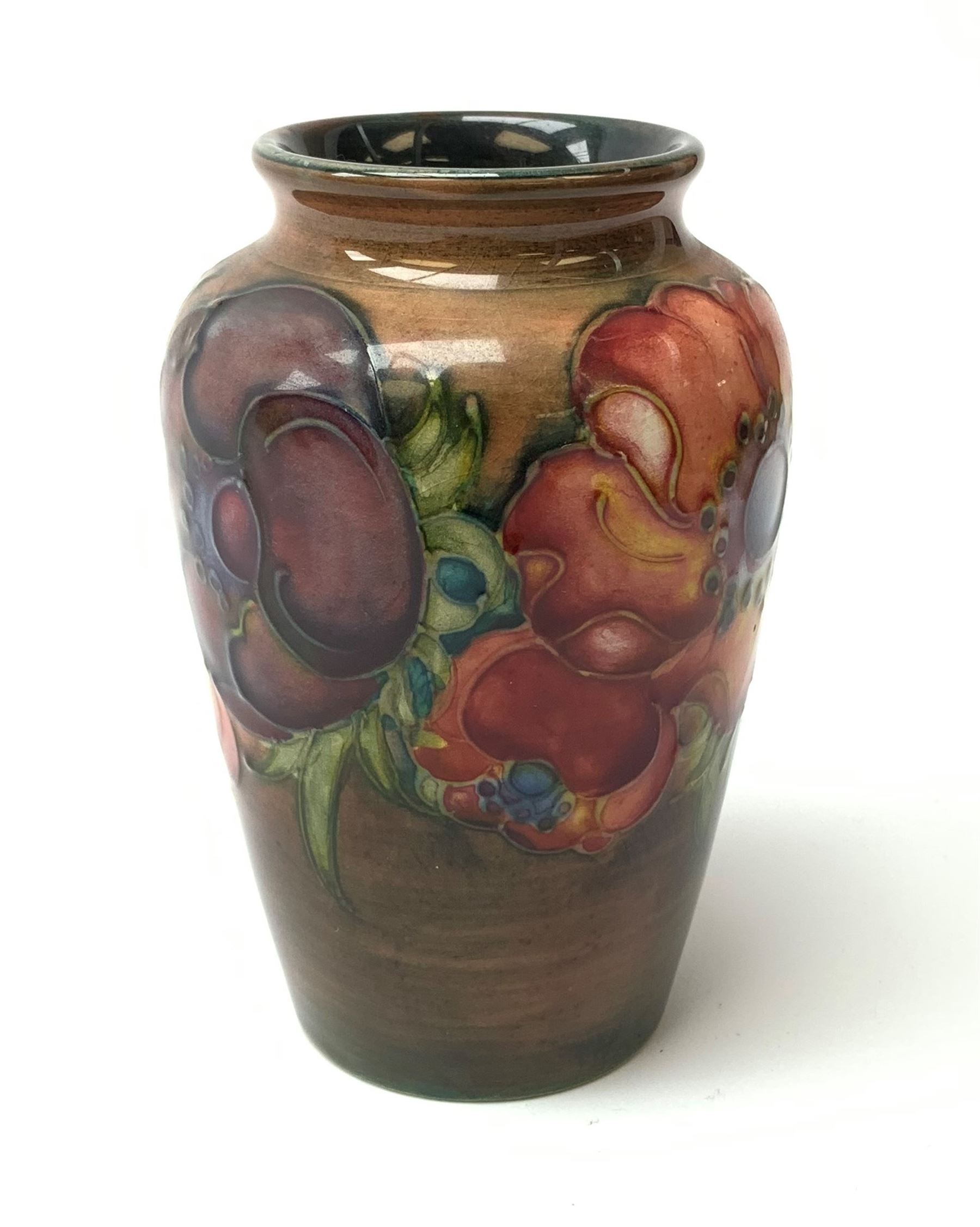 A Moorcroft flambe vase, decorated in the Anemone pattern, with impressed marks beneath, H10.5cm. 