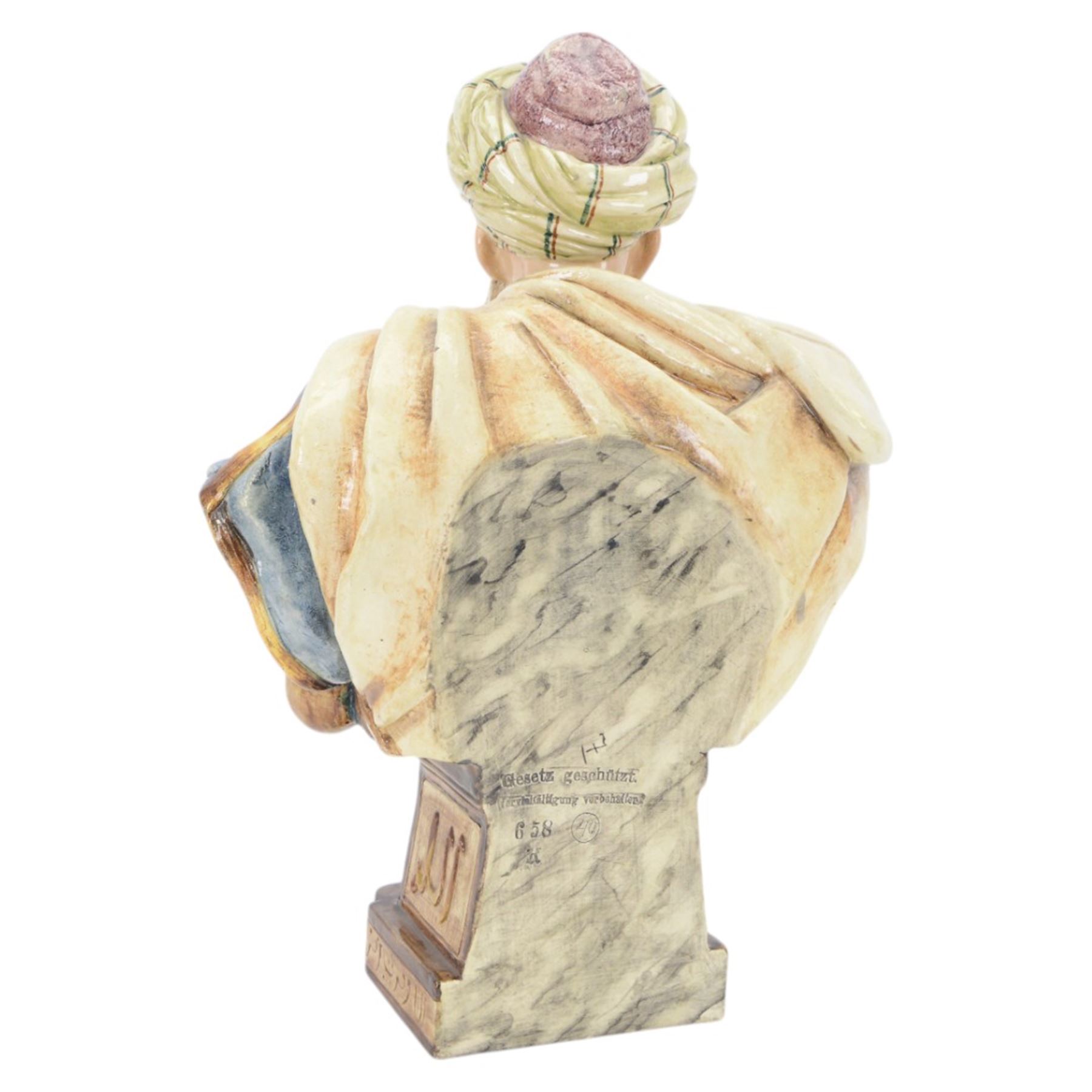 Pair of 19th century German majolica busts, modelled after biblical figures, as a male and female figure in Eastern dress, upon a plinth detailed with script, impressed marks verso 'Gesetz Geschützt' , H37cm