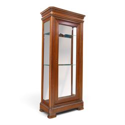 Barker & Stonehouse - cherrywood glazed cabinet, moulded projecting cornice glazed panels to the front and sides, mirrored back with adjustable glass shelves, moulded plinth base above short bun feet