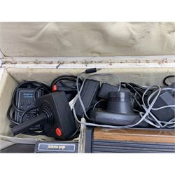 Atari 2600 'Woody' console with various joysticks and controllers etc, and a quantity of game cassettes to include 'Outlaw', 'Air Sea Seattle' and 'Codebreaker' etc housed in white painted wood case