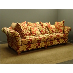  Grande four seat sofa upholstered in red and gold floral fabric, with scatter cushions, W255cm, D96cm - 18 months old  