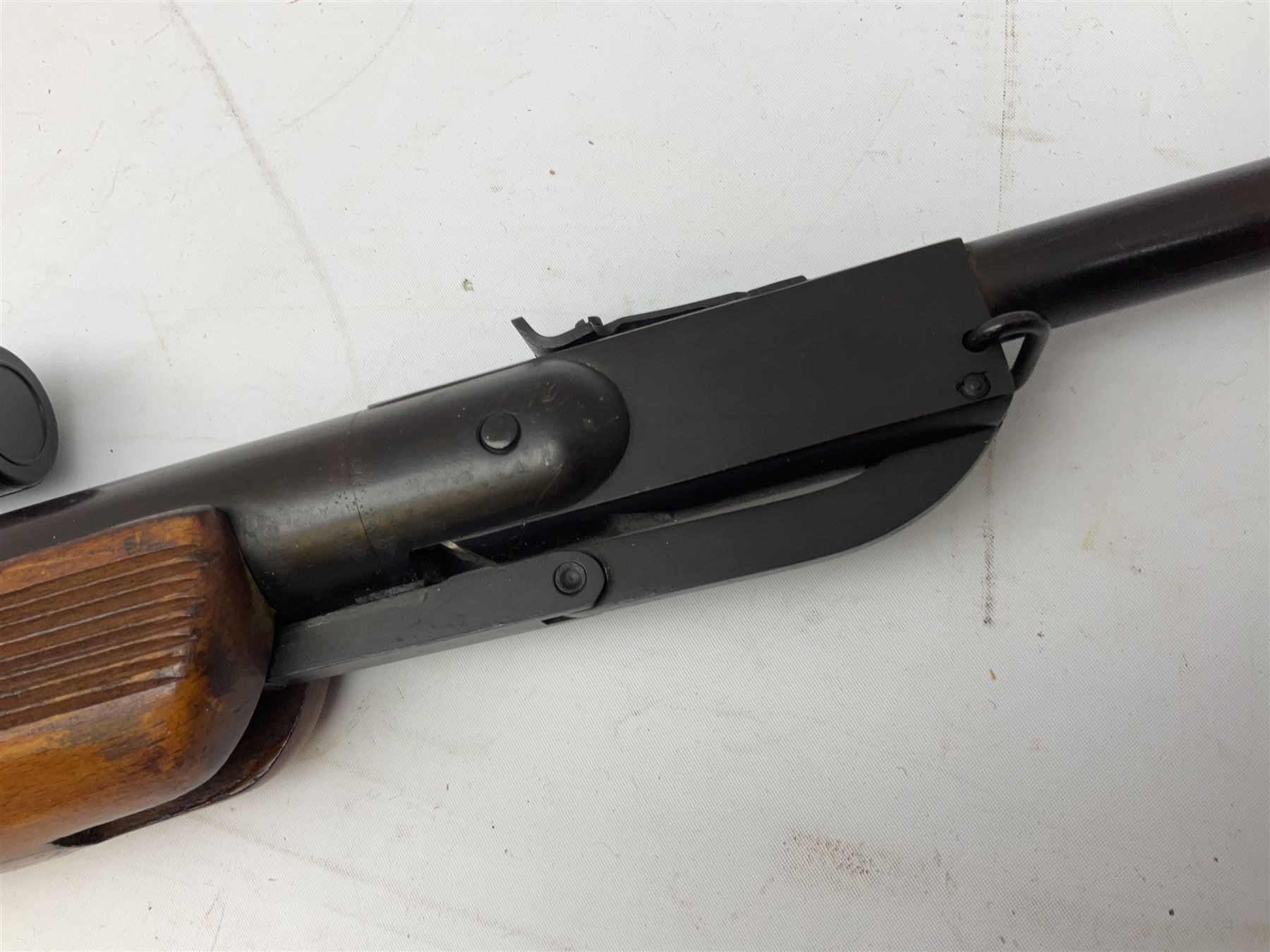 .22 air rifle with break barrel action and 48cm barrel; no visible maker but marked 'Foreign' No.55951; fitted with 4x20 telescopic sight L109cm overall