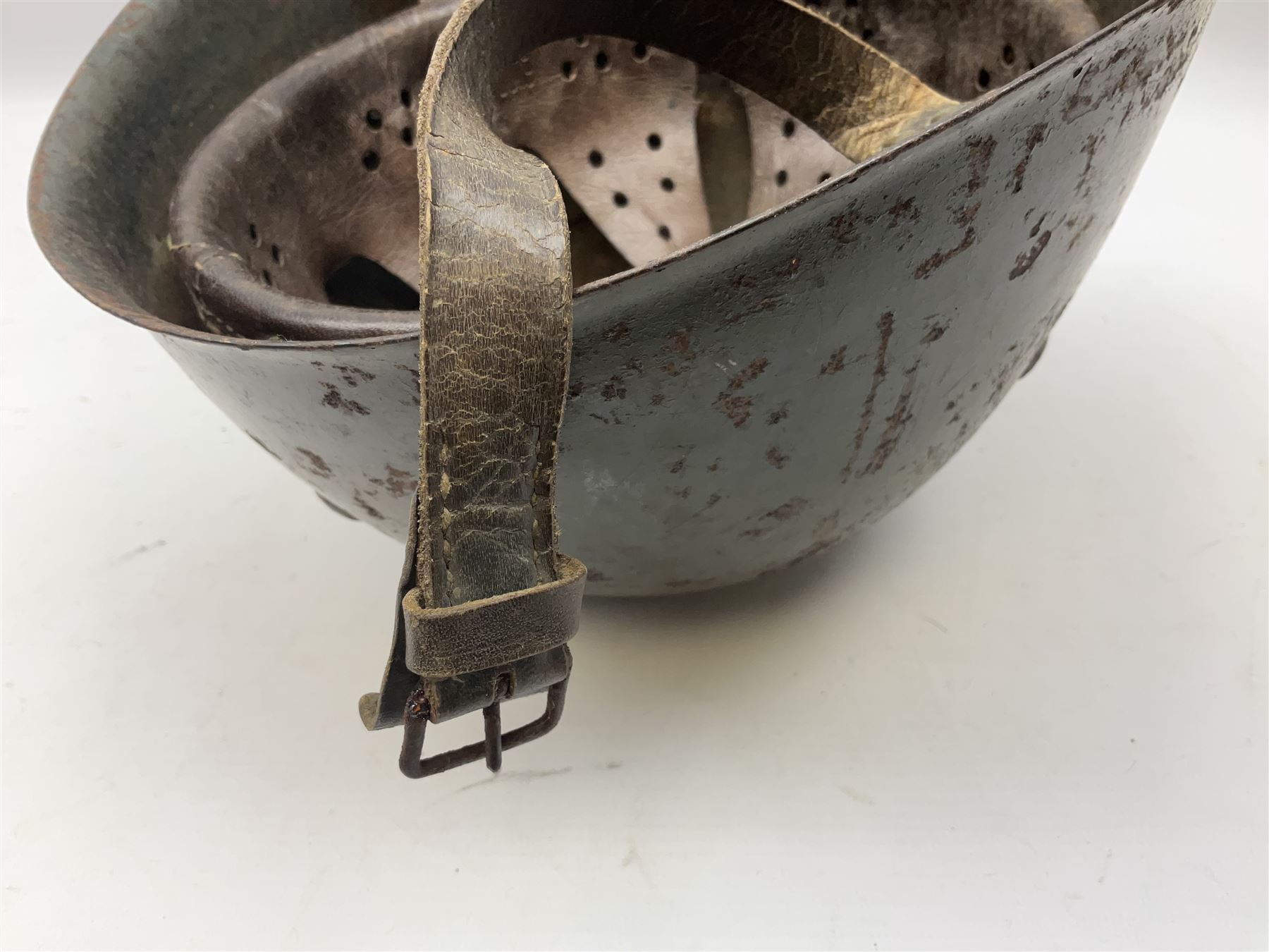 WWII Italian steel helmet with liner and chin strap