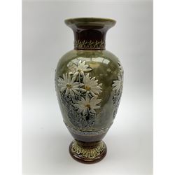 A Doulton Lambeth vase, of ovoid form decorated with white flowers in low relief, between foliate bands, with impressed marks beneath, H31cm. 