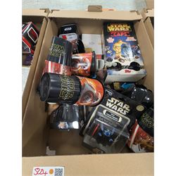 Star Wars collectables, including Mandalorian helmet, Topps foil caps, plastic cups, mug, figures, Masterworks Movie collection, Return of the Jedi Poster, magnets, watch, etc,in three boxes