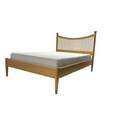 Arts & Crafts design oak double bedstead, concave shaped headboard with spindle supports