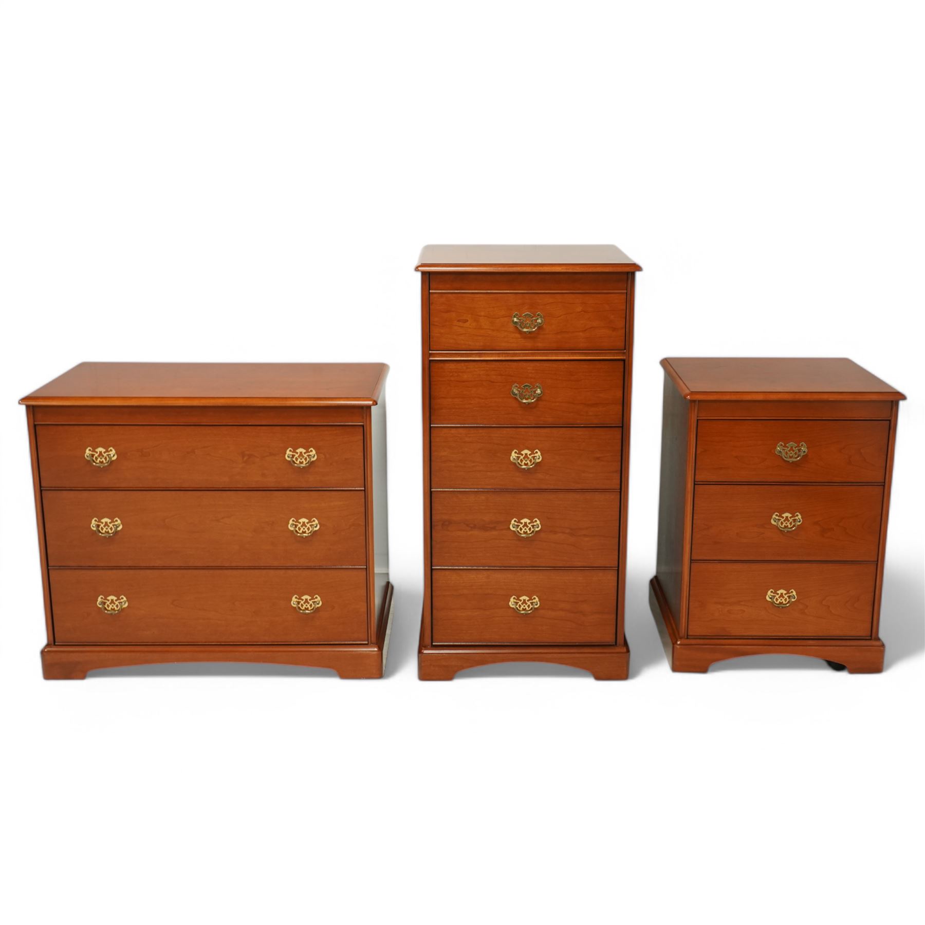 Stag - 'Carolina Cherry' three drawer chest (L 84cm, D 43cm, H 72cm); tall pedestal chest with hinged mirror top(L 53cm, D 43cm, H 104cm); bedside chest (L 53cm, D 43cm, H 72cm)