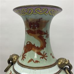 Pair of early 20th century Chinese vases decorated with dragons chasing a flaming pearl, with a gilt border of butterflies and floral sprigs, with Elephant head handles, H44cm 