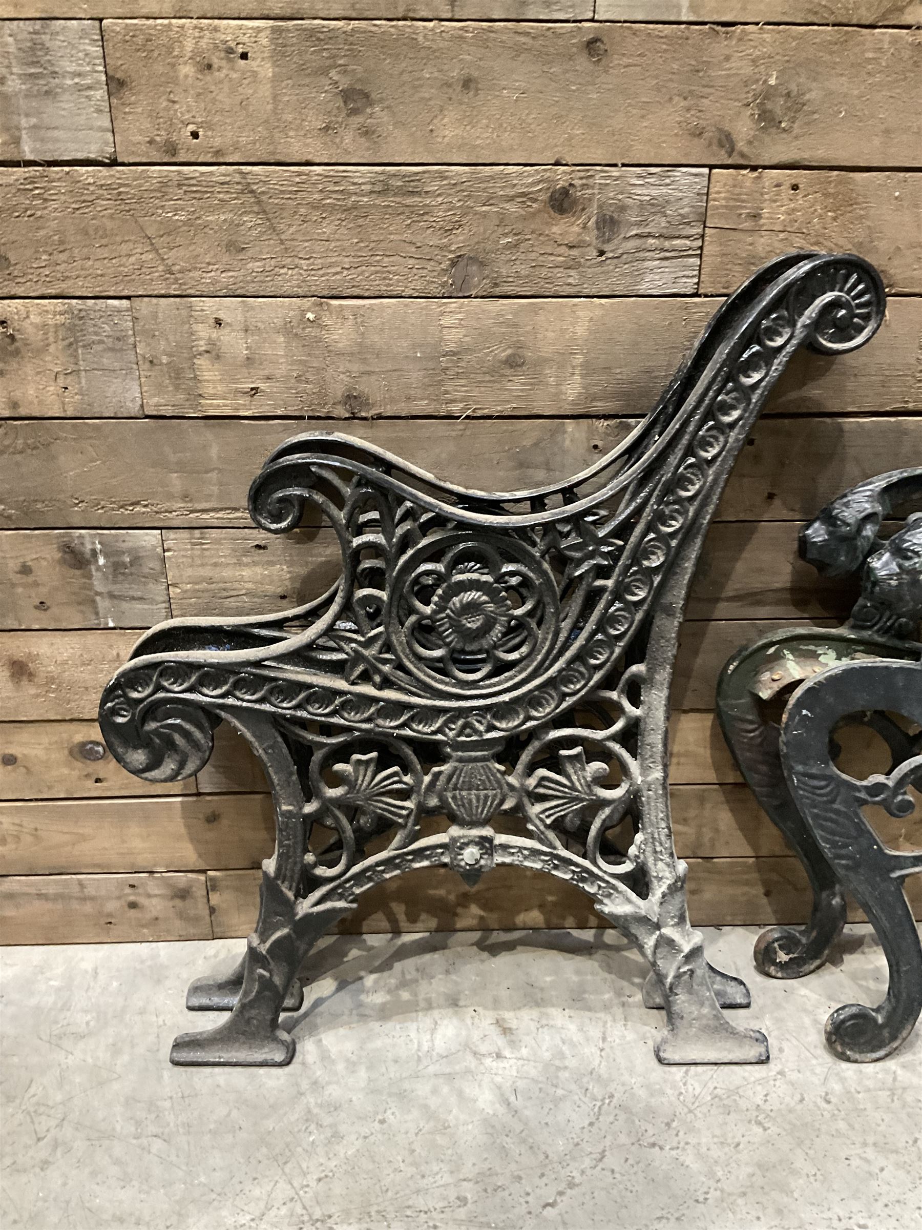 Four pairs of ornate cast iron bench ends (8)