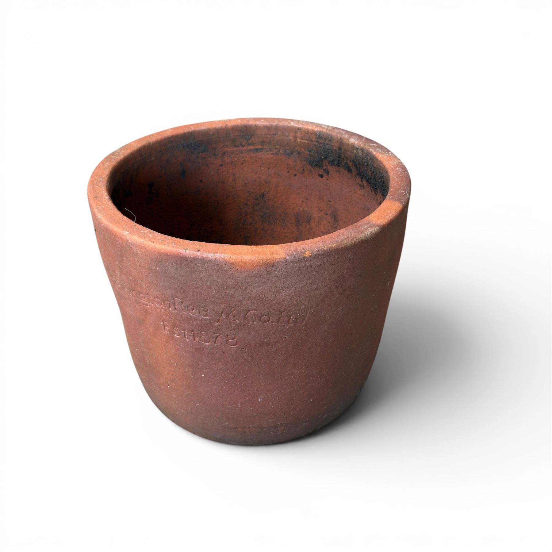 Large terracotta circular planter, oval form with ribbed top, planted; and an Errington Reay & Sons terracotta planter