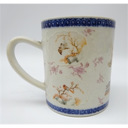  18th century Chinese tankard, painted with a Family in interior setting and relief cartouche panels painted with exotic birds within a blue and white diaper border, H13cm    