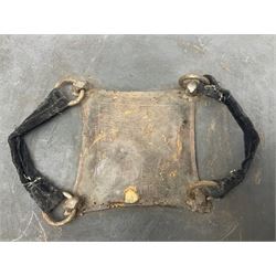 Indian black lacquered hide shield/dhal, of circular convex form fitted at its centre with four pierced iron bosses, each of hemispherical form with wide brims, the bosses corresponding on the inside with four iron rings for enarmes D53.5cm