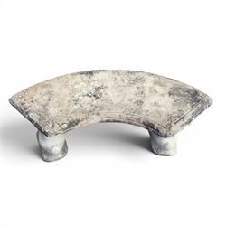 Weathered cast stone three-piece curved bench, raised on naturalist tree-stump style end supports