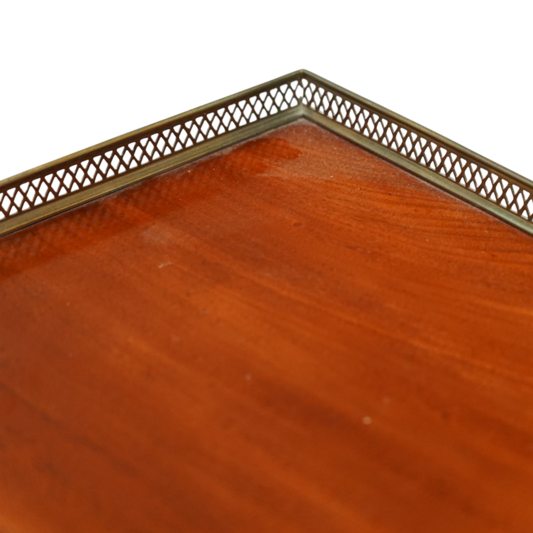 Late Regency mahogany side table in the manner of Gillows, the rectangular top with pierced brass gallery, raised on a reeded column and quatreform base with scroll carved feet with castors 