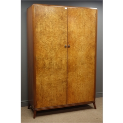  Mid 20th century walnut double wardrobe, two figured doors enclosing handing space and shelf, W123cm, H193cm, D52cm  