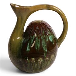 Dr Christopher Dresser - Linthorpe pottery hump back water jug with incised and green glaz...