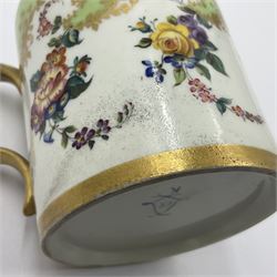 Sèvres soft paste porcelain coffee can and saucer with date code for 1754, painted and gilded with flowers, dangling from the shaped green border, interlaced LL monogram enclosing the date letter A above painters mark for Dodin, coffee can H7cm, saucer D14.5cm