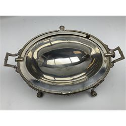 William Hutton & Sons silver plated entree dish, of oval form with twin handles, the revolving top with engraved monogram, upon four claw and ball feet, H22cm 