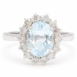 18ct white gold aquamarine and diamond cluster ring, single oval cut aquamarine of approx ...