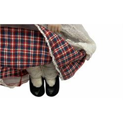 Heidi Ott doll in tartan dress, navy floral dress with white lace and ribbon detailing, striped blue and white dress and a 'Head to Toe' book