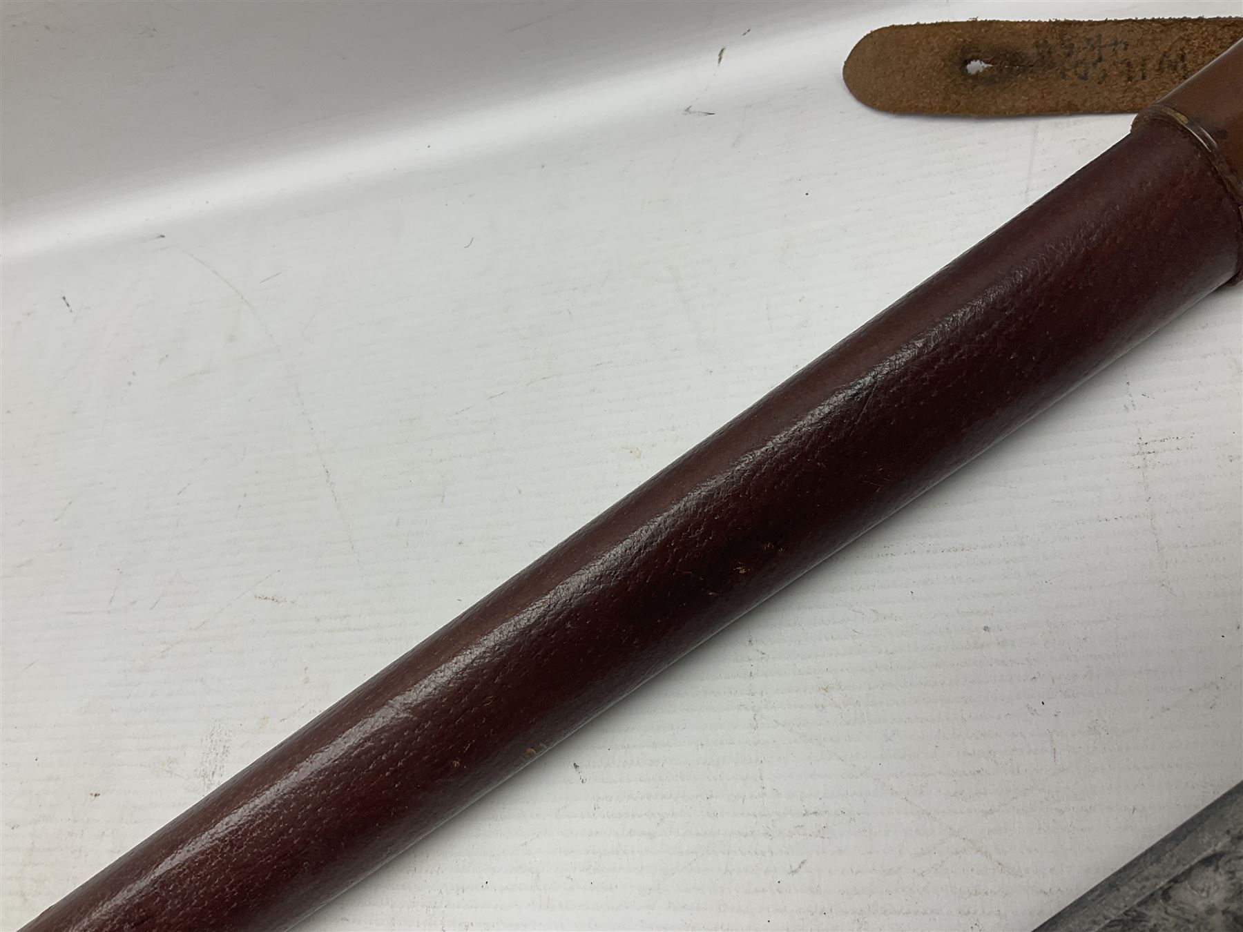 WWI 1821 pattern Royal Artillery officer's sword, the 82.5cm decorative blade by Hawksworth Sheffield etched with GVR cypher and crown, 'Royal Artillery' and field gun between scrolling foliate panels; three-bar hilt with wire-bound fish skin grip and chequered backstrap; in leather covered scabbard L99cm overall
