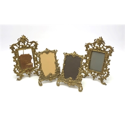 A pair of 19th century gilt metal rococo style frames, H29cm, together with two smaller later examples, H23cm. (4). 