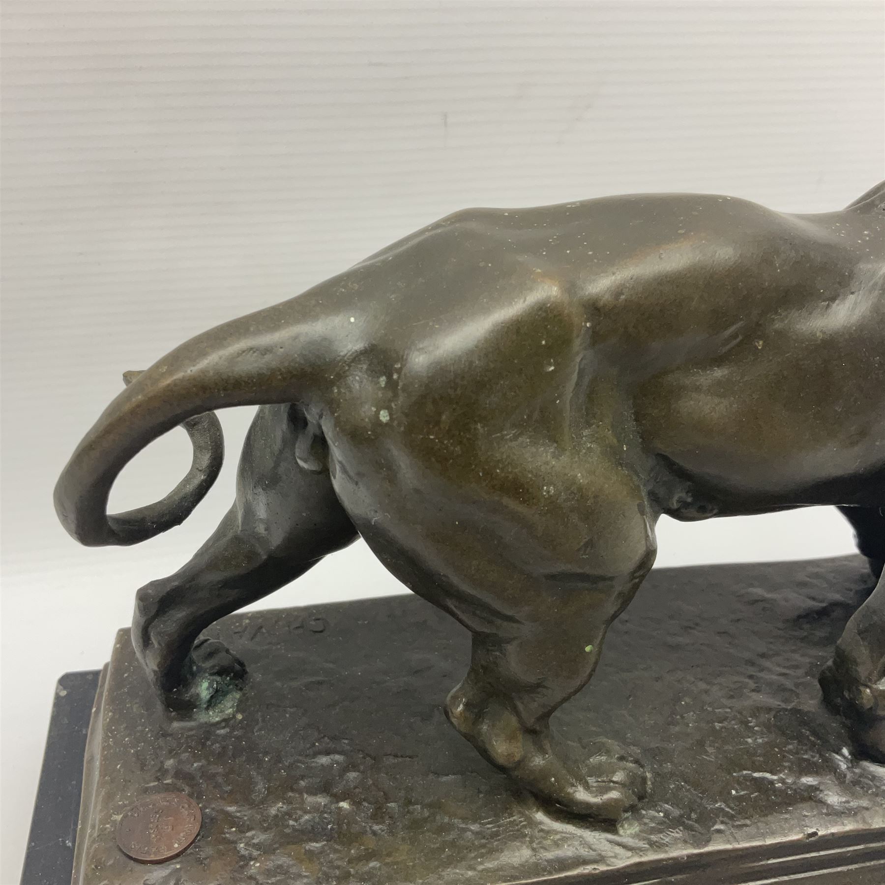 After Charles Valton, bronze, modelled as a lion, upon bronze plinth signed C H Valton, with foundry seal for J B Deposee, and black marble plinth base, overall H20cm L26cm
