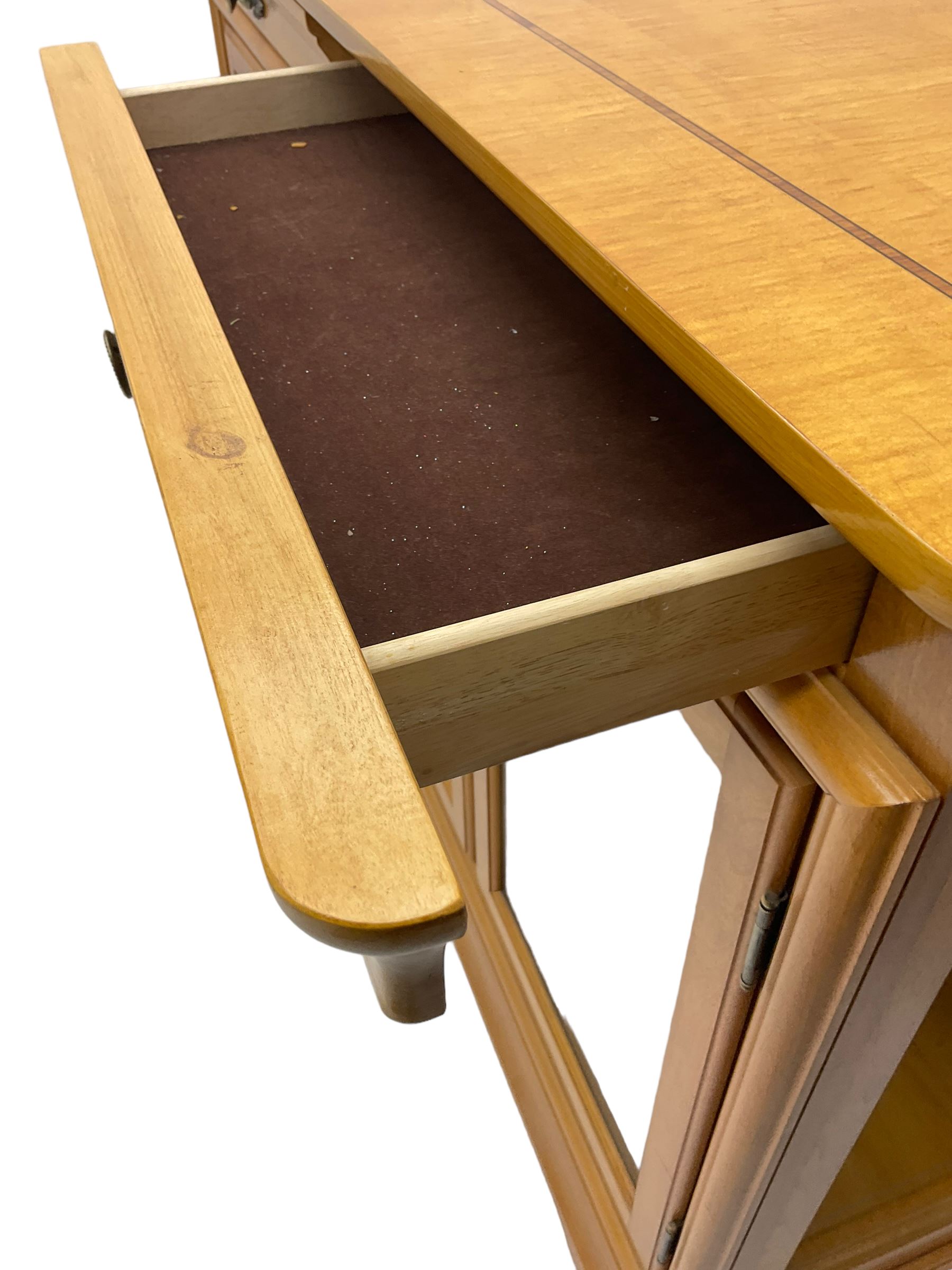 Yew wood sideboard, rectangular top with mahogany and ebony stringing, fitted with two drawers over three glazed cupboard doors enclosing glass shelves